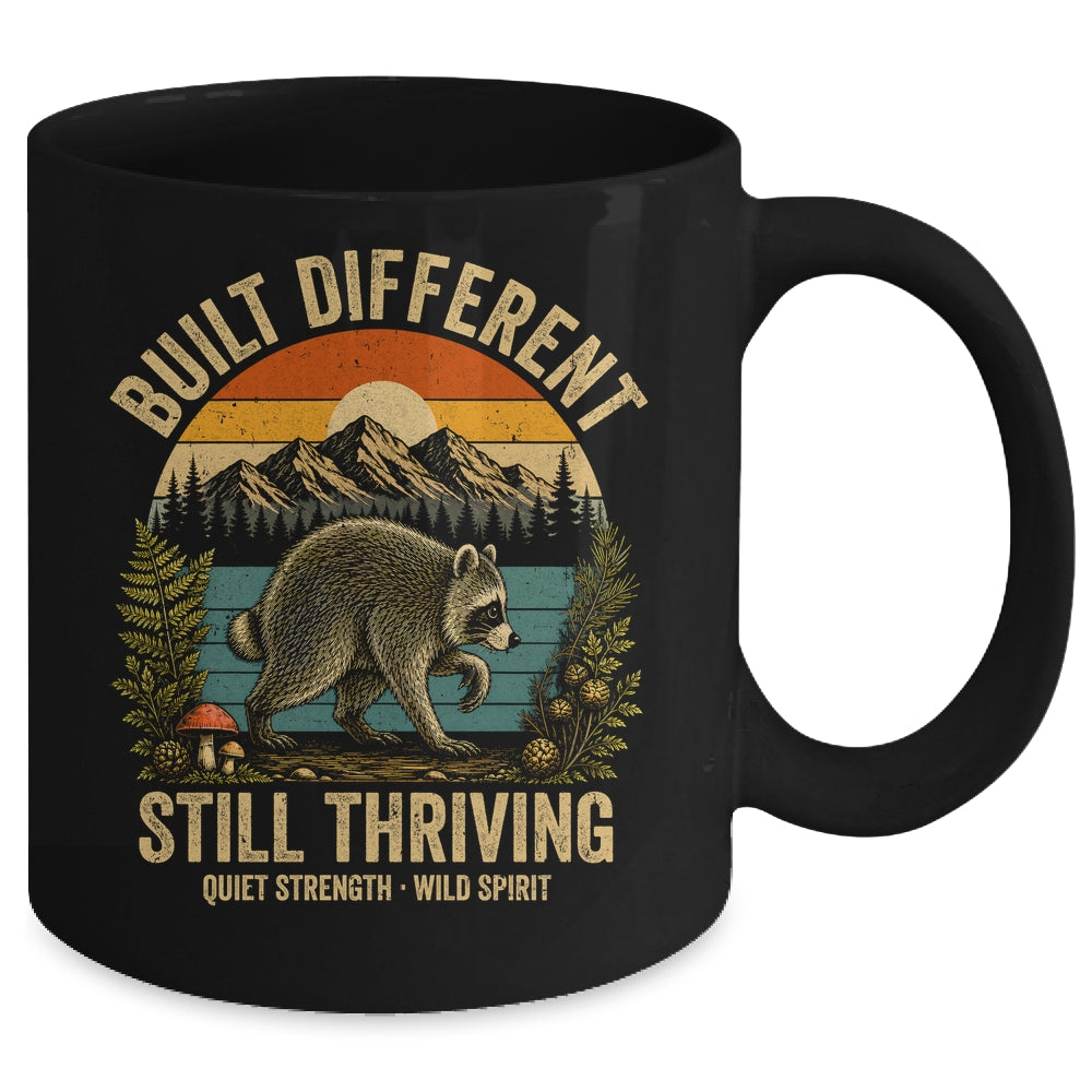 Built Different Still Thriving Raccoon Funny Vintage Mug | siriusteestore