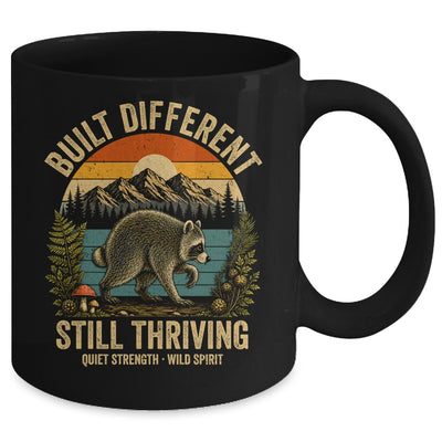 Built Different Still Thriving Raccoon Funny Vintage Mug | siriusteestore
