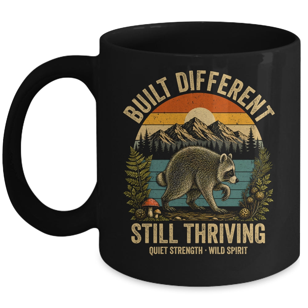 Built Different Still Thriving Raccoon Funny Vintage Mug | siriusteestore