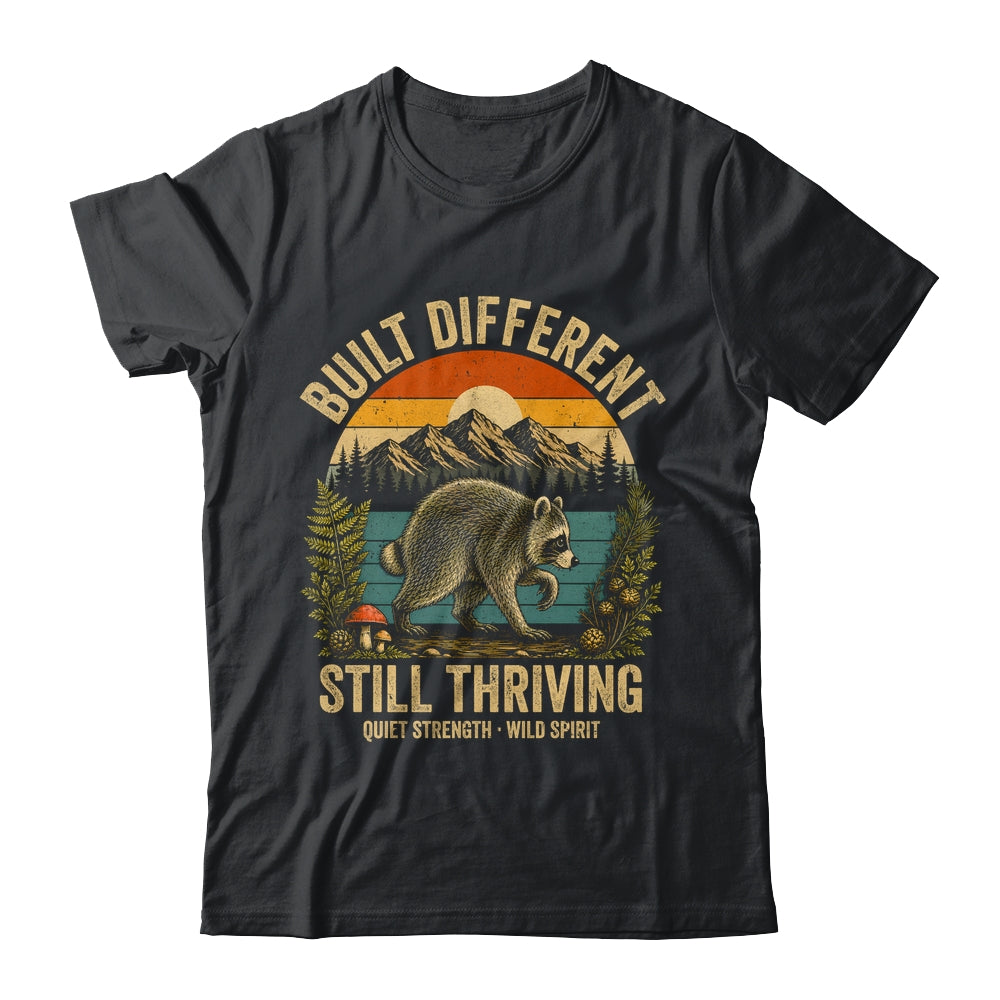 Built Different Still Thriving Raccoon Funny Vintage Shirt & Tank Top | siriusteestore
