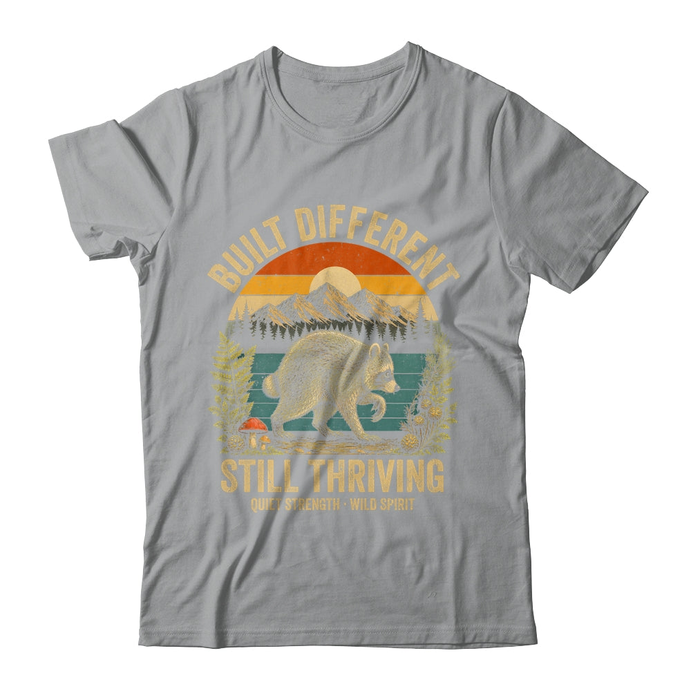 Built Different Still Thriving Raccoon Funny Vintage Shirt & Tank Top | siriusteestore