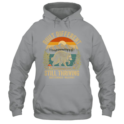 Built Different Still Thriving Raccoon Funny Vintage Shirt & Tank Top | siriusteestore